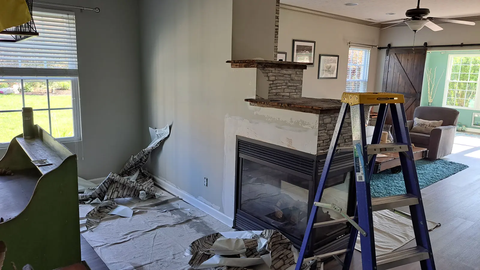 Interior walls being cut in and rolled by hand